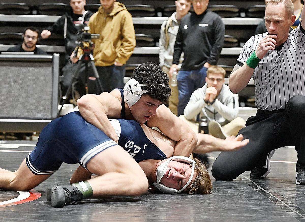 Penn State’s Beau Bartlett looks to score nearfall points on teammate Tyler Kasak during their 141-pound title match of the Black Knight Invite on Sunday in the Christl Arena at West Point, N.Y. Bartlett edged Kasak, who was making his Nittany Lions debut, 4-1, in sudden victory.
