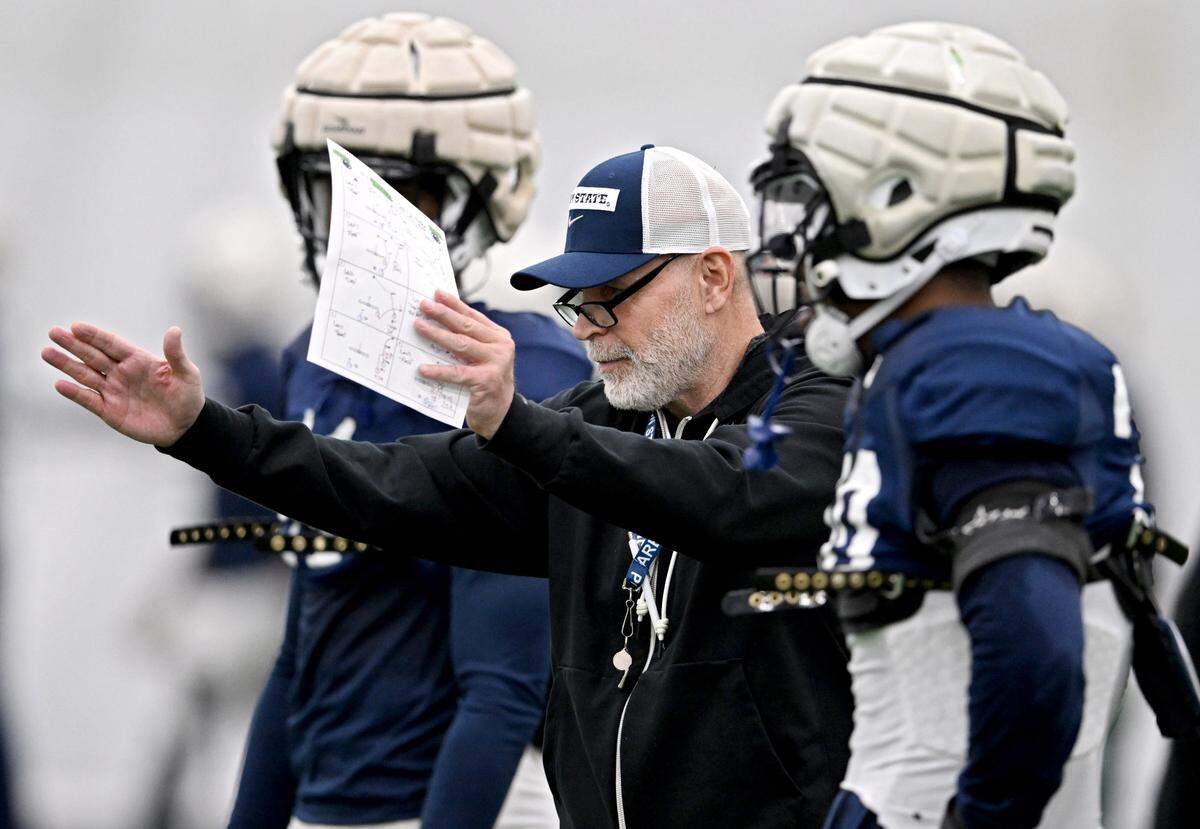 Penn State defensive coordinator Jim Knowles talks to players during spring practice on Tuesday, April 8, 2025.  