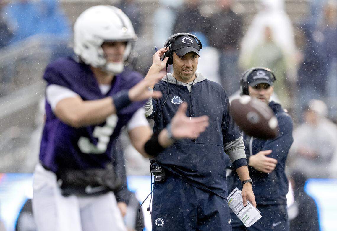 Penn State football coach Matt Campbell watches as Rocco Becht gets the ball to run a play during Blue-White Practice on Saturday, April 25, 2026.  