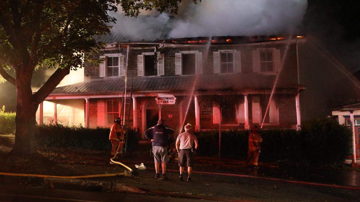Crews fight a fire at the Woodward Inn in Haines Township early Sunday morning.