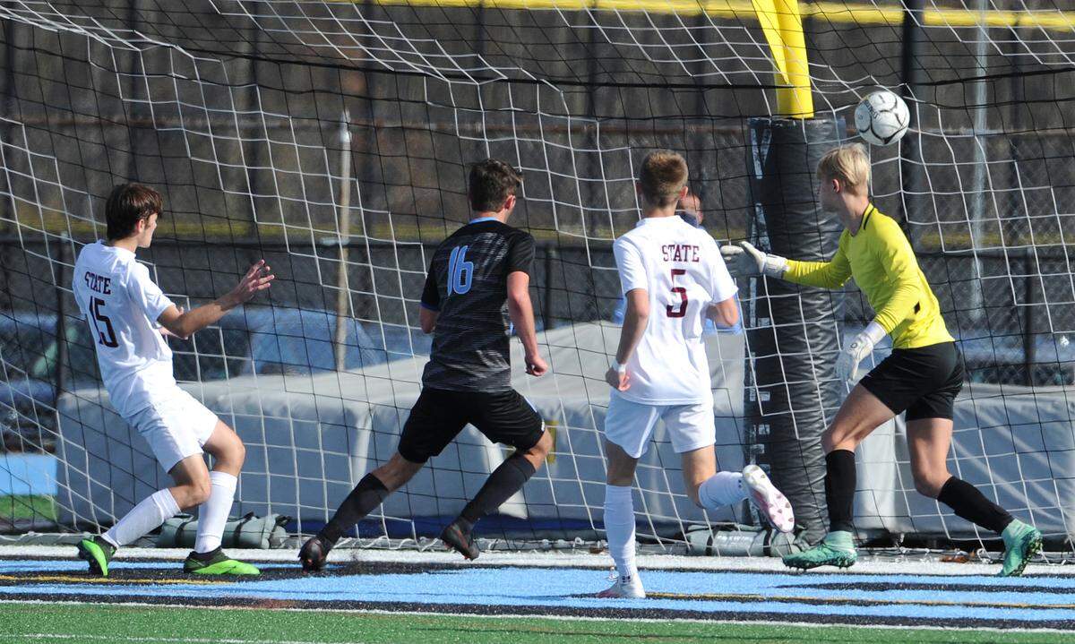 Seneca Valley forward Zach LaValle (16) watches the ball sail past State College goal keeper (1) in the second half of PIAA quarter final action at Seneca Valley Saturday, November 14, 2020. Seneca Valley won 6-0 to advance to the PIAA 4A semifinals.