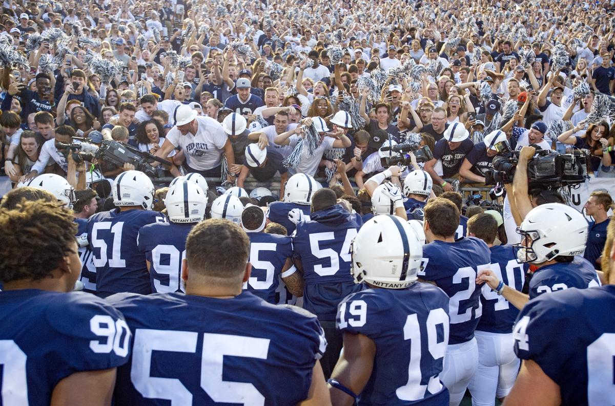 The team celebrates with Penn State cornerback Amani Oruwariye and the student sections after his interception to beat Appalachian State in overtime Saturday, Sept. 1, 2018 game at Beaver Stadium.