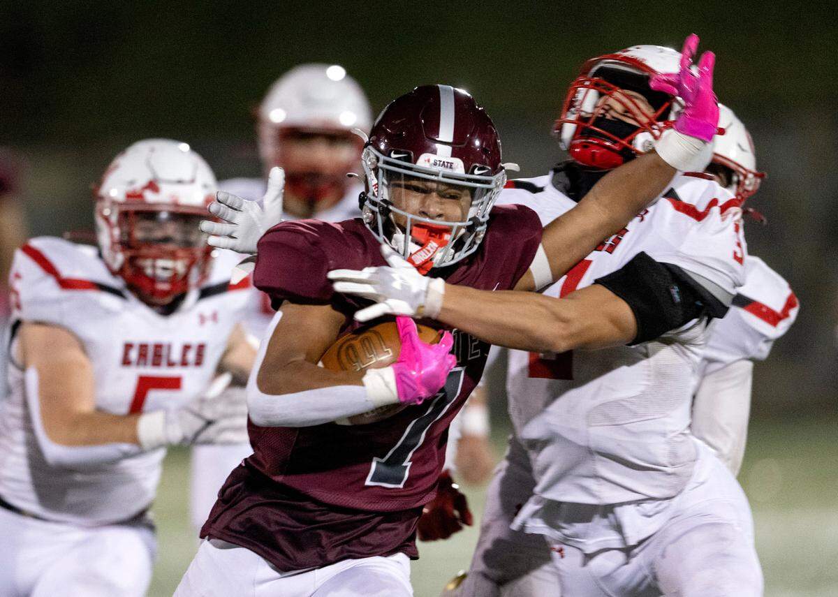 State College’s D’antae Sheffey cuts around Cumberland Valley defenders during the game on Friday, Oct. 21, 2022 at Memorial Field.