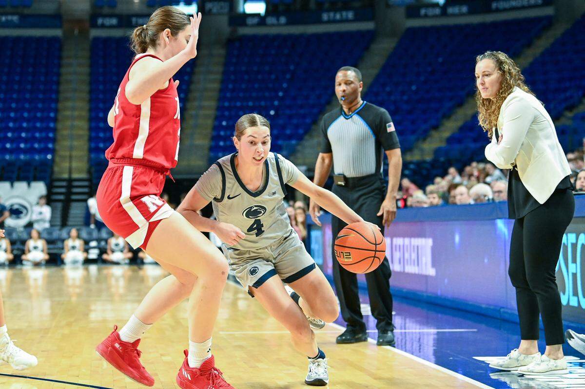 Penn State’s Shay Ciezki drives around a Nebraska player in their win over the Cornhuskers on Jan. 21.