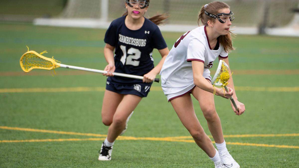 State College’s Sydney O’Donnell runs past a defender during a PIAA lacrosse game between State High and Chambersburg on April 15 in State College, Pa.