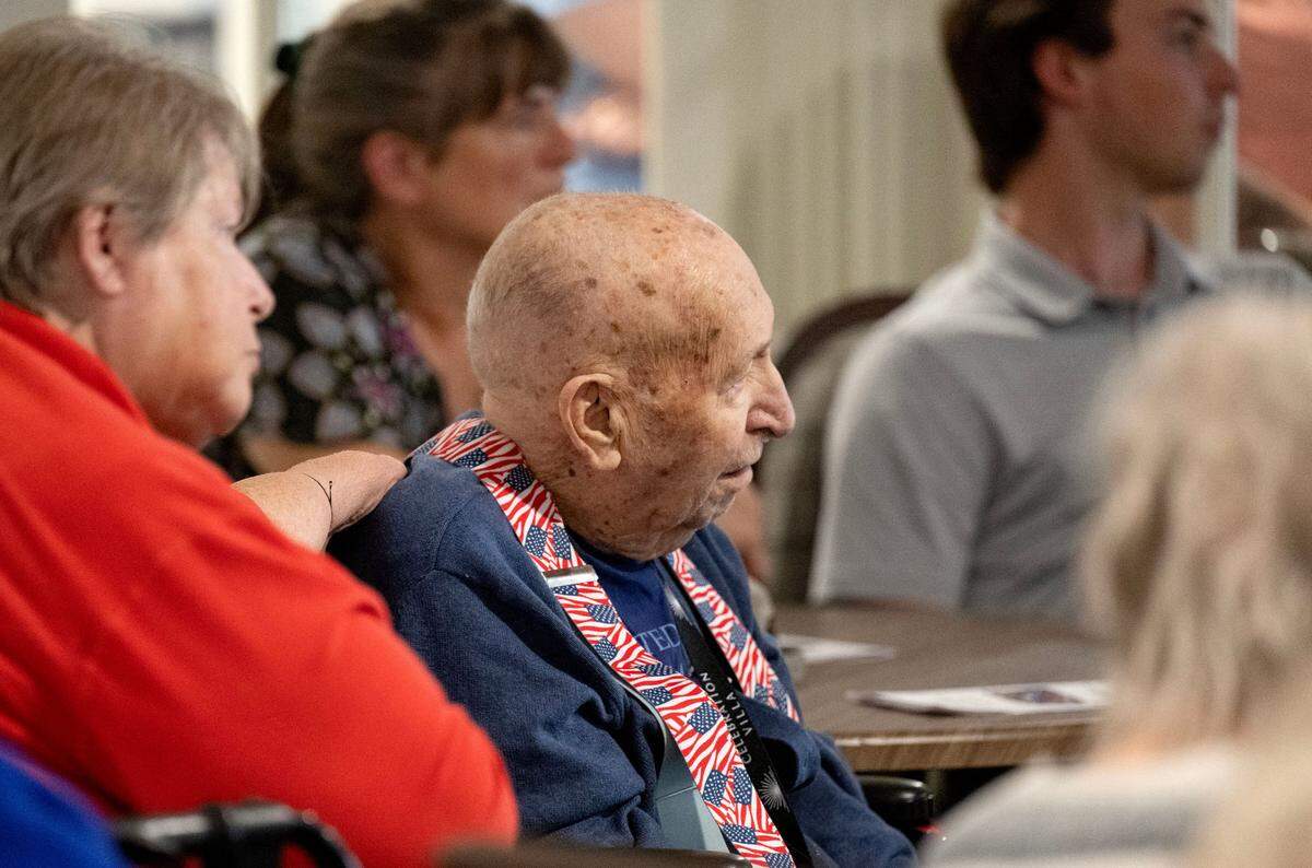 Bruce Berkey is emotional as he listens to the history of the Korean War during an Ambassador of Peace Medal presentation at Celebration Villa of Nittany Valley on Friday, July 18, 2025.