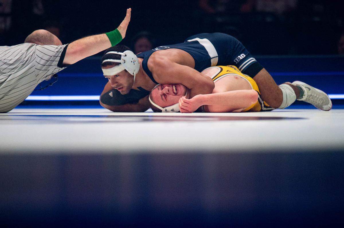 At 149, Shayne Van Ness, top, wrestles Gabe Willochell, bottom, during the dual meet between Penn State and Wyoming on Sunday, Dec. 15, 2024.