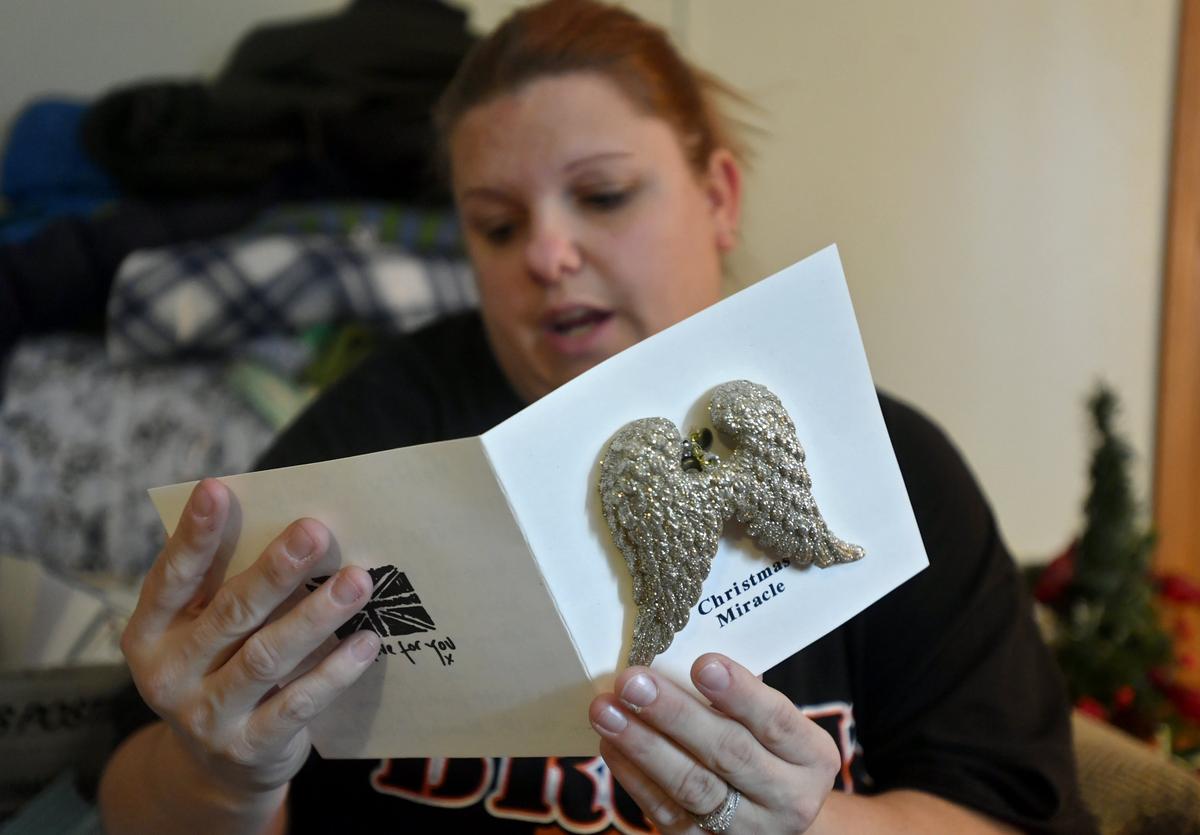 A key and angel wins hangs on the front of a card Kristi Potter reads that was sent to her son Maddox on Thursday, Dec. 20, 2018.