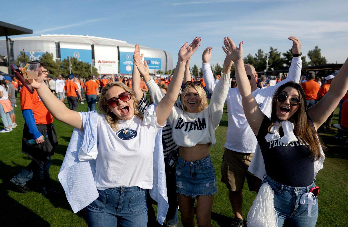 Penn State fans from Scranton sing along to the “YMCA” outside of State Farm Stadium before the Fiesta Bowl on Tuesday, Dec. 31, 2024.