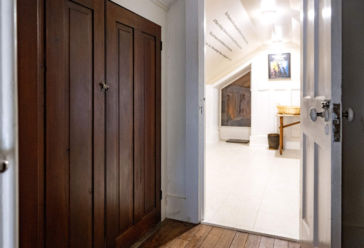 A closet door that opened to a crawl space and hidden room on the top floor of the Bellefonte Art Museum. The space now features the exhibit “A Journey to Freedom.”