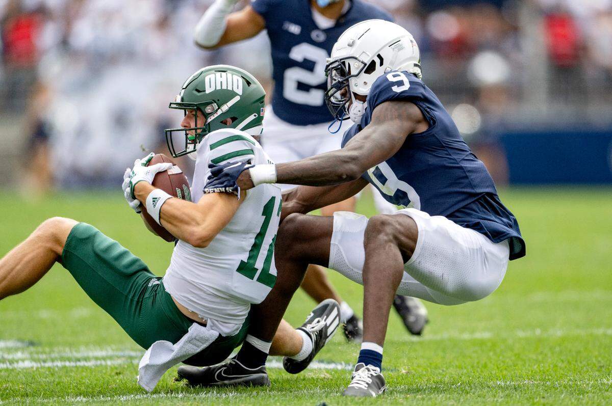 Penn State cornerback Joey Porter Jr. pulls down Ohio’s ball carrier Sam Wiglusz during the game on Saturday, Sept. 10, 2022.