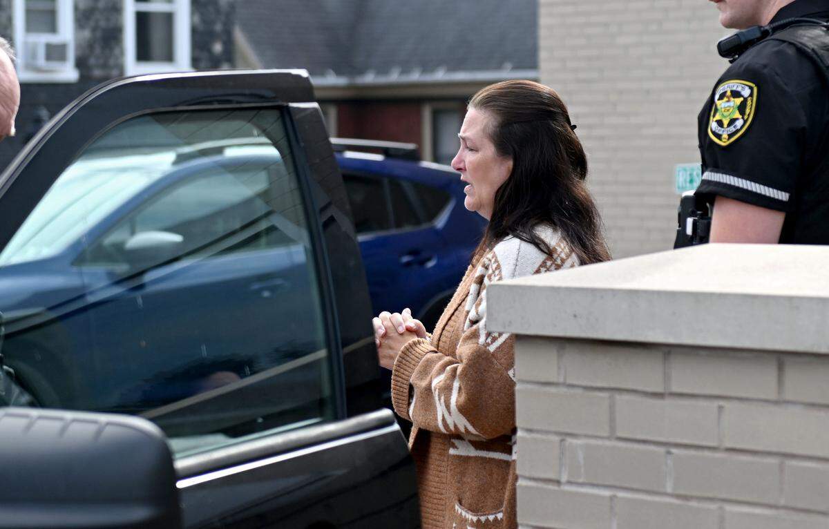 Former Gregg Township secretary and treasurer Pamela Hackenburg is escorted out of the Centre County Courthouse after her sentencing on Sept. 16, 2025.