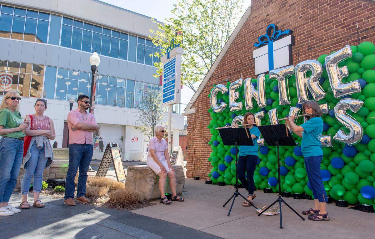 Cecilia Leskowicz and Cathy Herrera from the Flutopia Initiative play during Centre Gives Fest on Wednesday at the MLK Plaza.