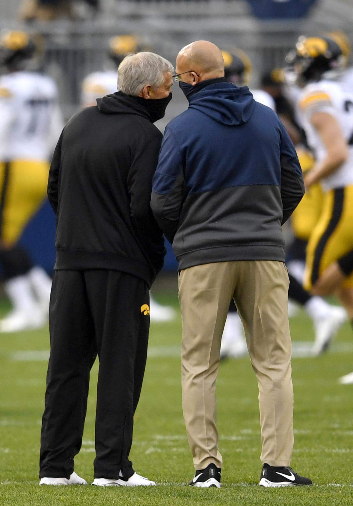 Iowa football coach Kirk Ferentz talks with Penn State football coach James Franklin before the game on Saturday, Nov. 21, 2020 at Beaver Stadium.