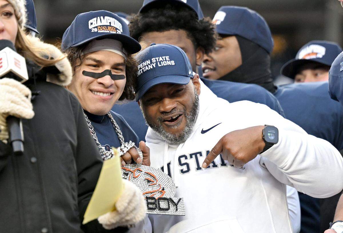 Penn State wide receiver Trebor Pena and interim coach Terry Smith celebrate after the win over Clemson in the Pinstripe Bowl at Yankee Stadium on Saturday, Dec. 27, 2025.  