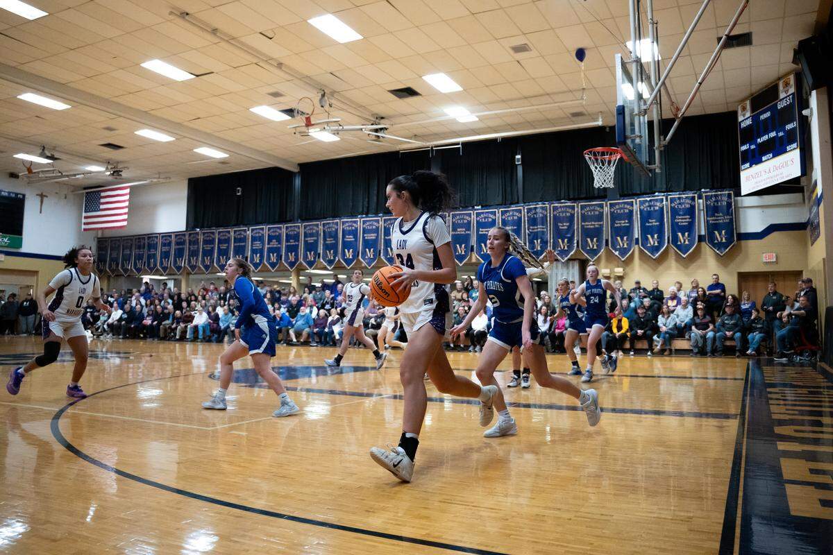 Bishop Guilfoyle’s Stella Yeskey (34) dribbles around defenders during a game against Williamsburg in Altoona, Pa., on Thursday, Feb. 19, 2026. The Lady Marauders defeated the Lady Pirates 61-31.