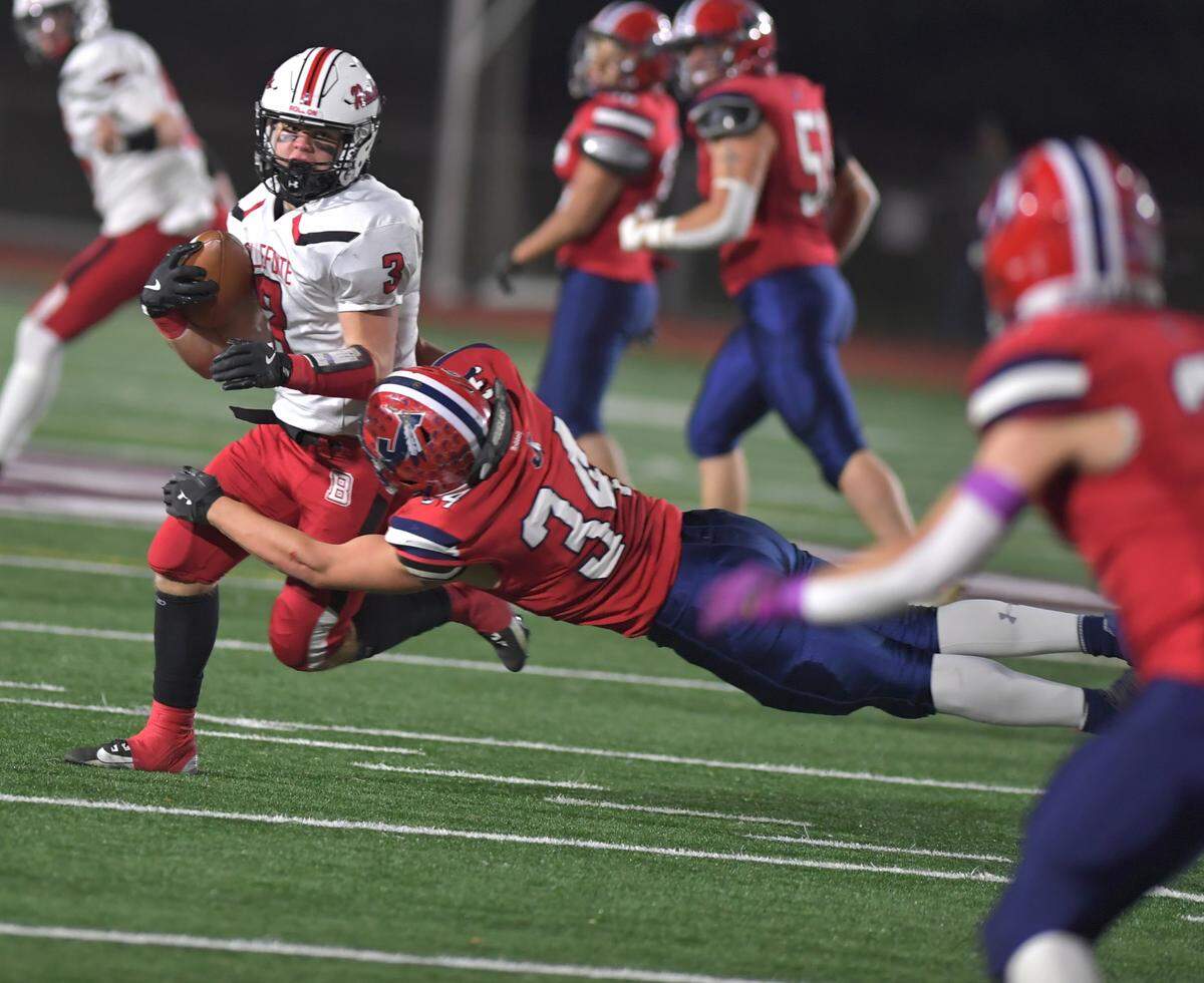 Bellefonte’s Isaac Gall (3) is brought down by Juniata’s Lane Peiper in third quarter action of the District 6 Class 4A Championship on Saturday, Nov. 9, at Altoona’s Mansion Park Stadium.