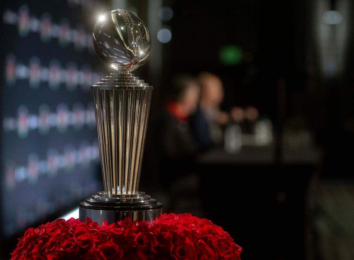The Leishman Trophy sits surrounded by roses as Utah coach Kyle Whittingham and Penn State coach James Franklin have a press conference for the Rose Bowl on Sunday, Jan. 1, 2023.
