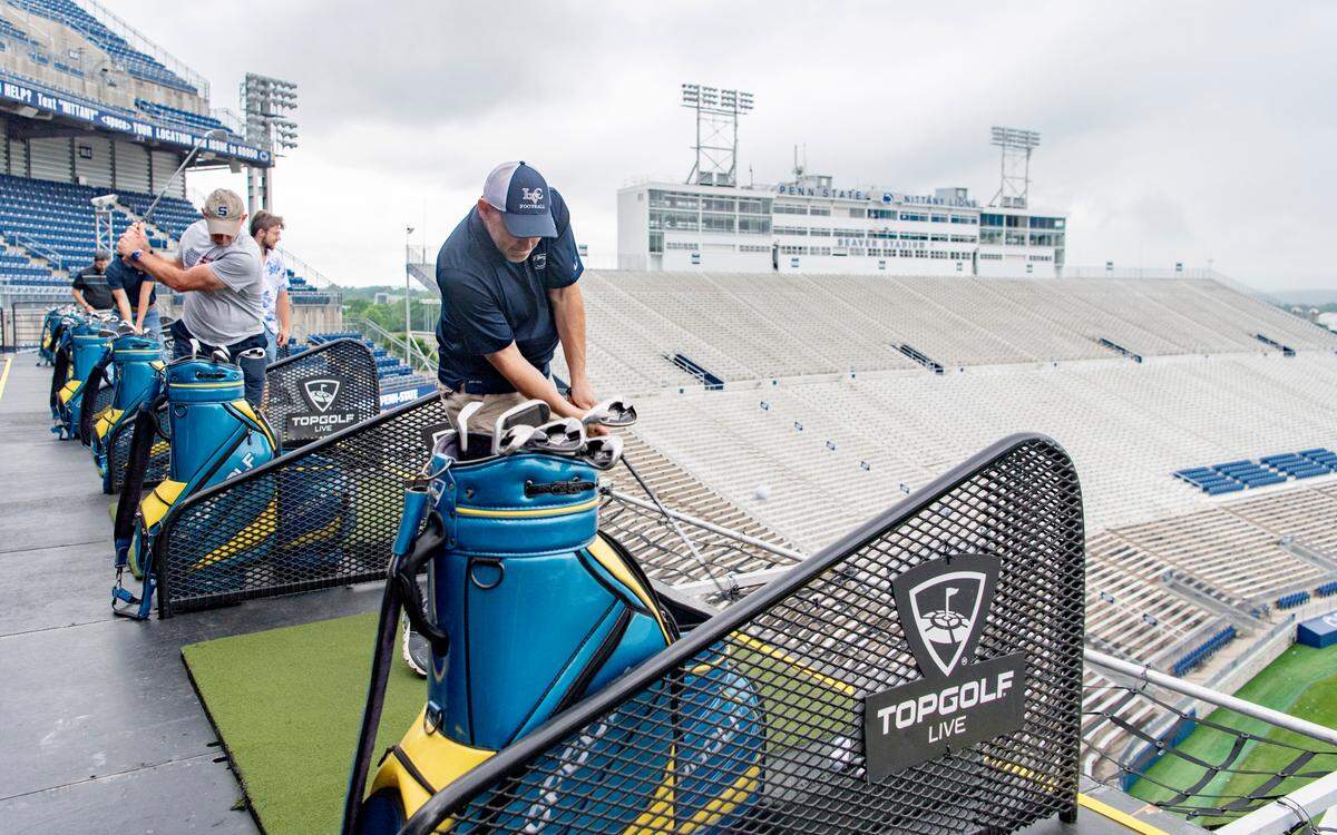 Greg Kohler takes a swing at Topgolf Live at Beaver Stadium offers games, food and drinks on Thursday, June 2, 2022.