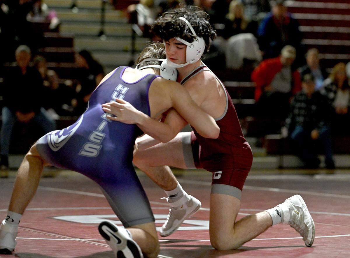 State College’s James Whitbred wrestles Mifflin County’s Kamden Everly in the 133 lb bout of the match on Thursday, Jan. 25, 2024.