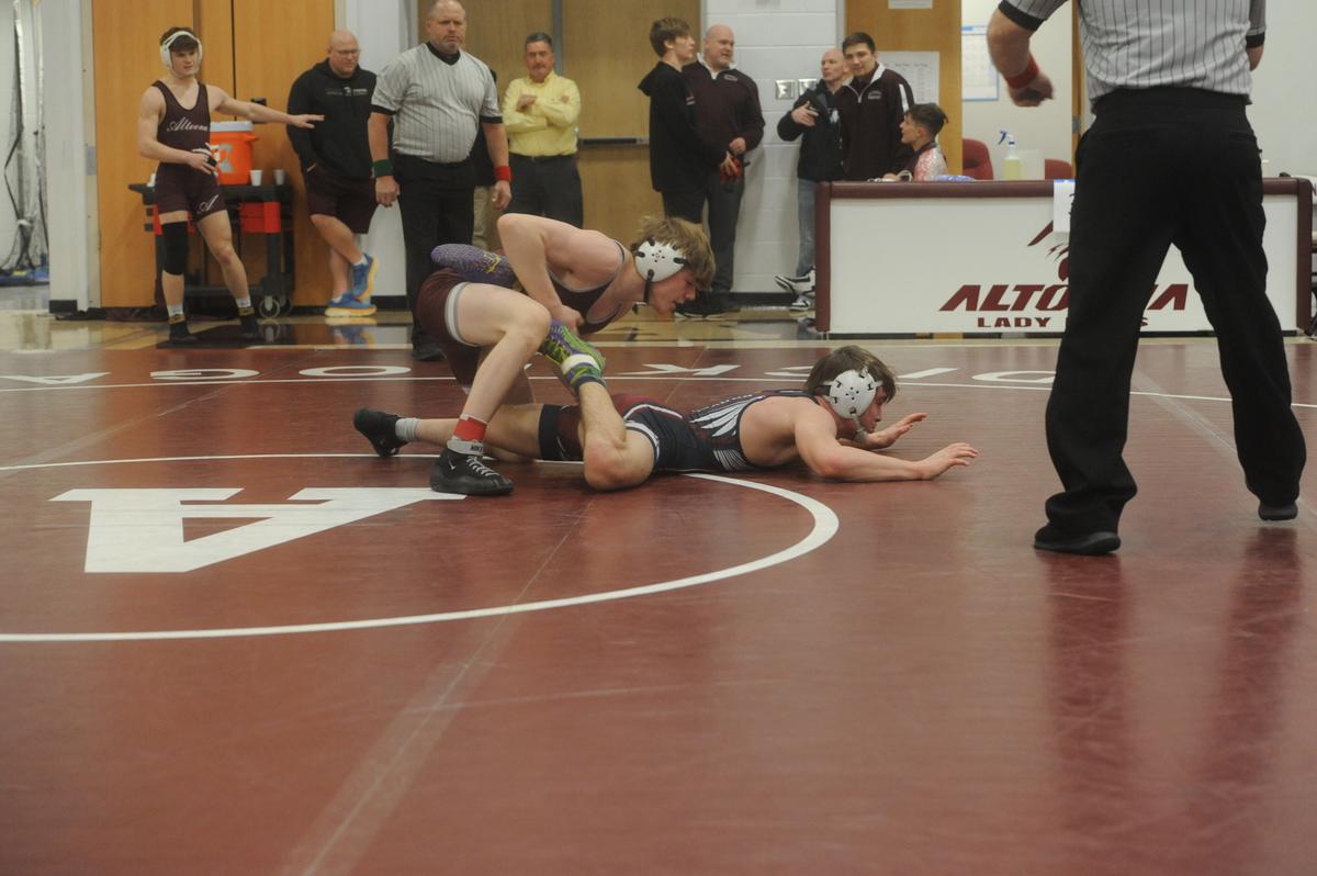 State College’s Asher Cunningham finishes off a reversal of Shikellamy’s CJ Keener in their 145-pound quarterfinals match of the PIAA Class 3A Northwest Regional Championships on Friday, Feb. 24, 2023 in Altoona. Cunningham pinned Keener in 4:41.