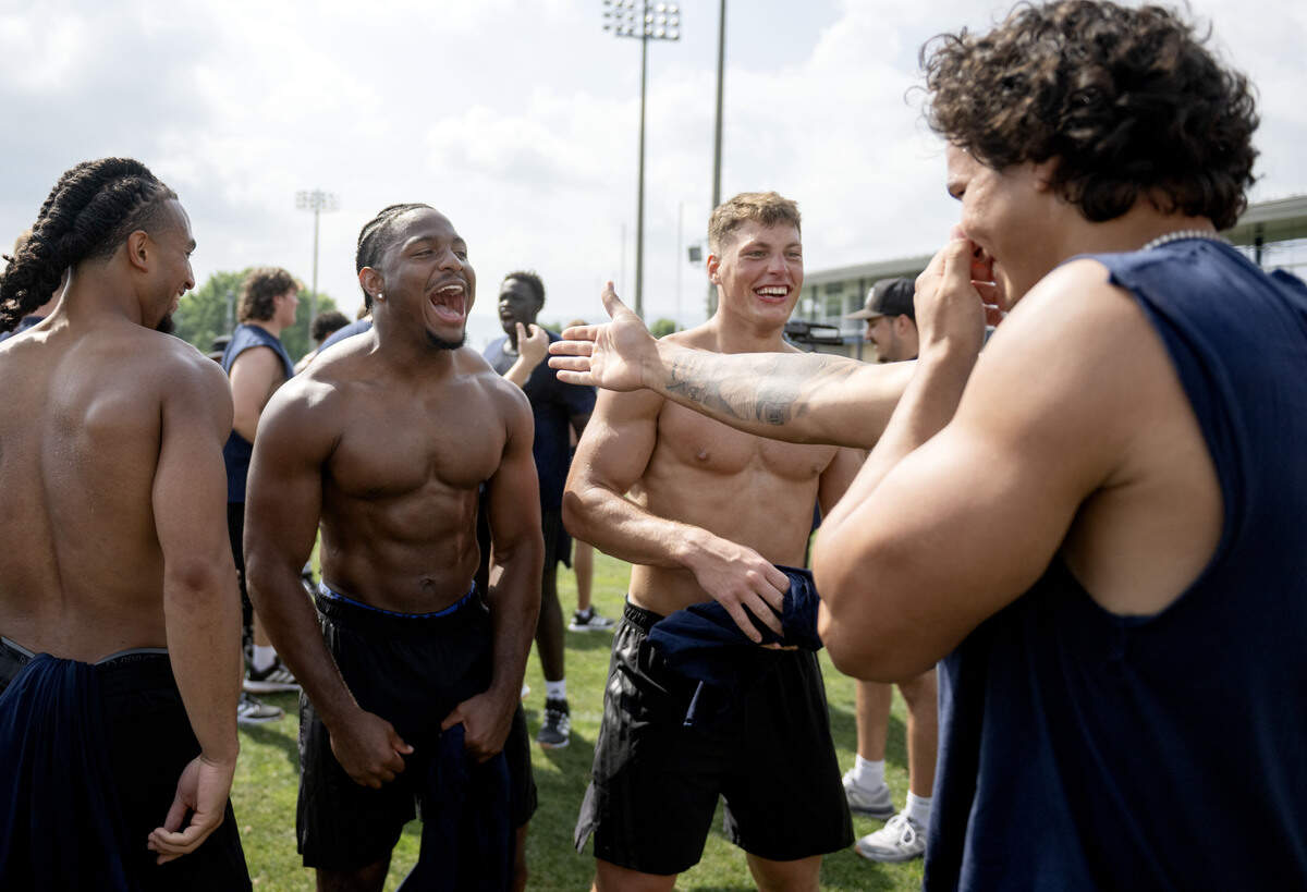 Penn State football players joke together after the winning team is announced during Lift For Life on Wednesday, July 1, 2026.