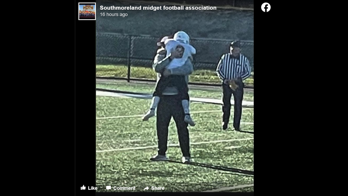 Coach Ron Frederick embraces a youth football player. The 40-year-old died suddenly after getting his dream coaching job with Southmoreland High School in Pennsylvania.