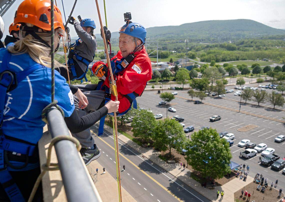 At 103 years old George Etzweiler repels down the side of Beaver Stadium for the the Centre County United Way Over the Edge fundraiser on Friday, May 19, 2023.