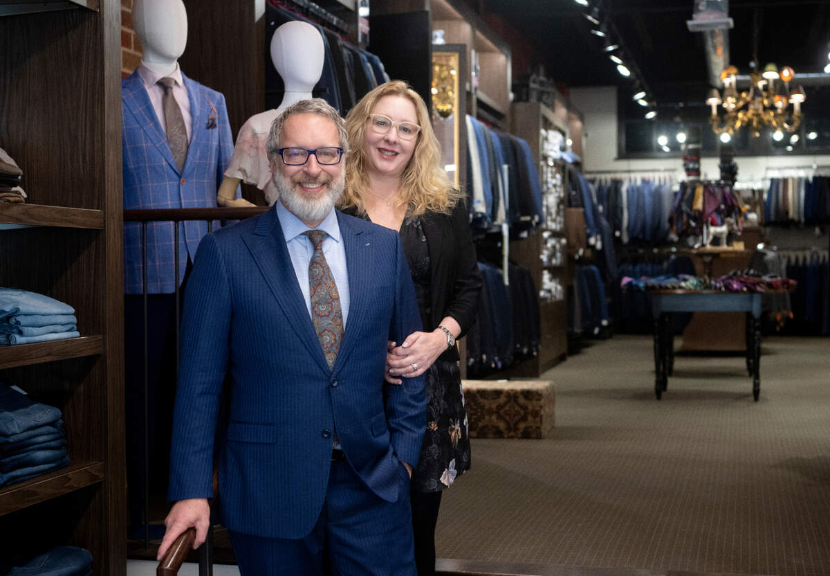 Brian and Lisa Cohen pose in their shop Harpers, a fine clothing store in downtown State College, on Friday, Feb. 24, 2023.