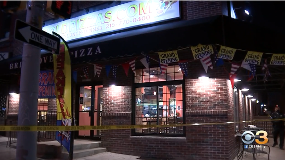 A man attempting to rob a Philadelphia pizza shop was shot by the teenage son of one of the workers, cops say.