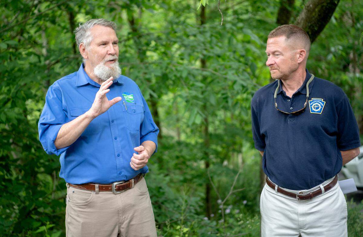 Department of Conservation and Natural Resources deputy secretary John Norbeck talks about the importance of the repairs needed for the Coburn pedestrian bridge that allows people to cross over Penns Creek on Thursday, June 9, 2022.