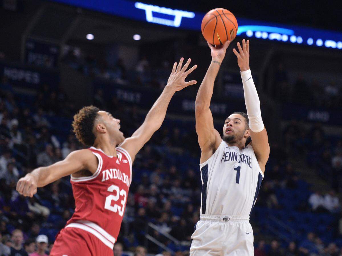 Penn State’s Seth Lundy (1) shoots over Indiana’s Trayce Jackson-Davis (23) during the first half of an NCAA college basketball game Wednesday, Jan. 11, 2023, in State College.