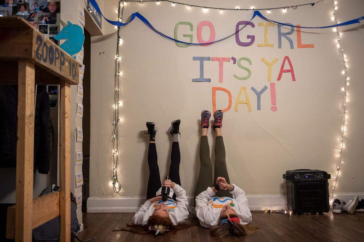 Addison Albert, left, and Brooke Schindelheim stretch before Thon begins on Friday in State College. Dancers usually fill the Bryce Jordan Center for the 46-hour dance marathon that raises money for the Four Diamonds childhood cancer charity, but the event is being held virtually due to the pandemic.