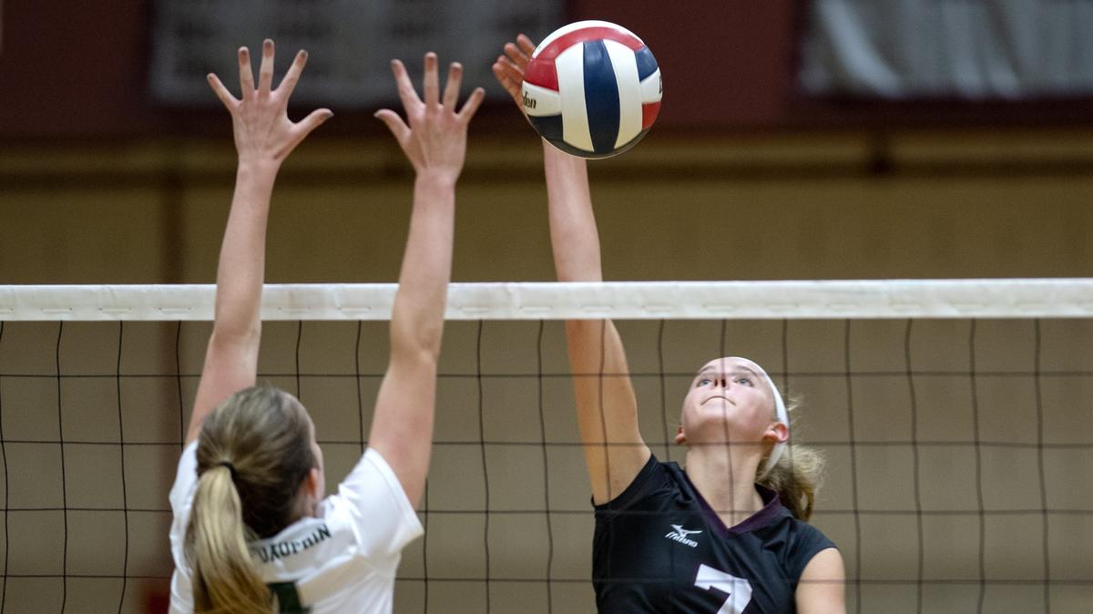 State College’s Kacy Sekunda hits the ball past a Central Dauphin defender during the match on Wednesday, Sept. 19, 2018.  State College won in 3 sets.