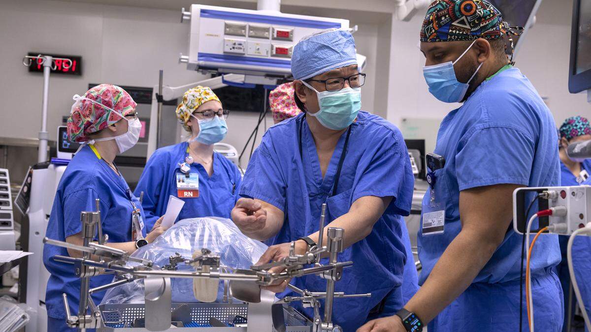 Dr. Johnny Hong, left, and Dr. Thomas Butler II work in operating room 29 during a training session for the surgical transplant team at Penn State Health Milton S. Hershey Medical Center on Monday, Feb. 6, 2023. Photo provided by Penn State Health.