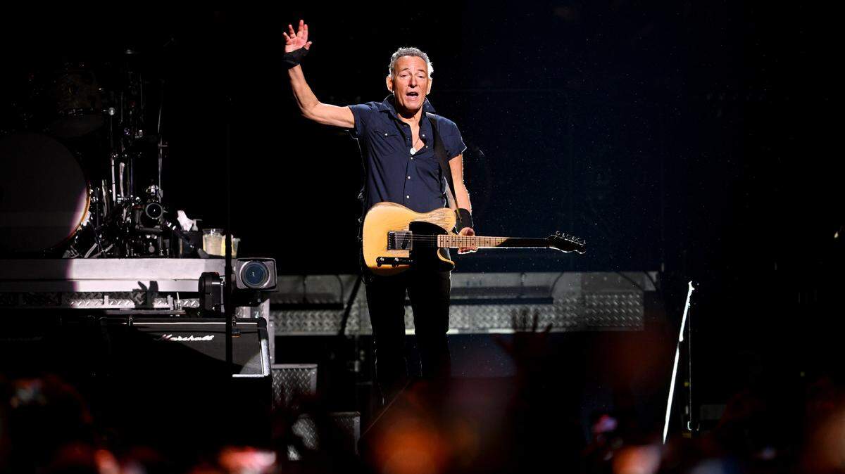 Bruce Springsteen waves to the sold-out Bryce Jordan Center crowd as he walks on stage for the show on Saturday, March 18, 2023.