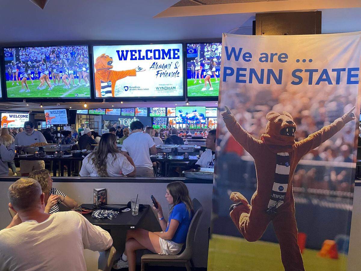 Penn State alums spend time at a mixer at Tom’s Watch Bar in Los Angeles on Friday night, before the Nittany Lions play USC on Saturday afternoon.