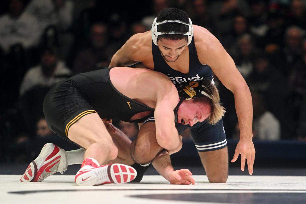 Iowa’s Max Murin wrestles Penn State Shayne Van Ness in the 149 lb bout of the match on Friday, Jan. 27, 2023 at the Bryce Jordan Center.