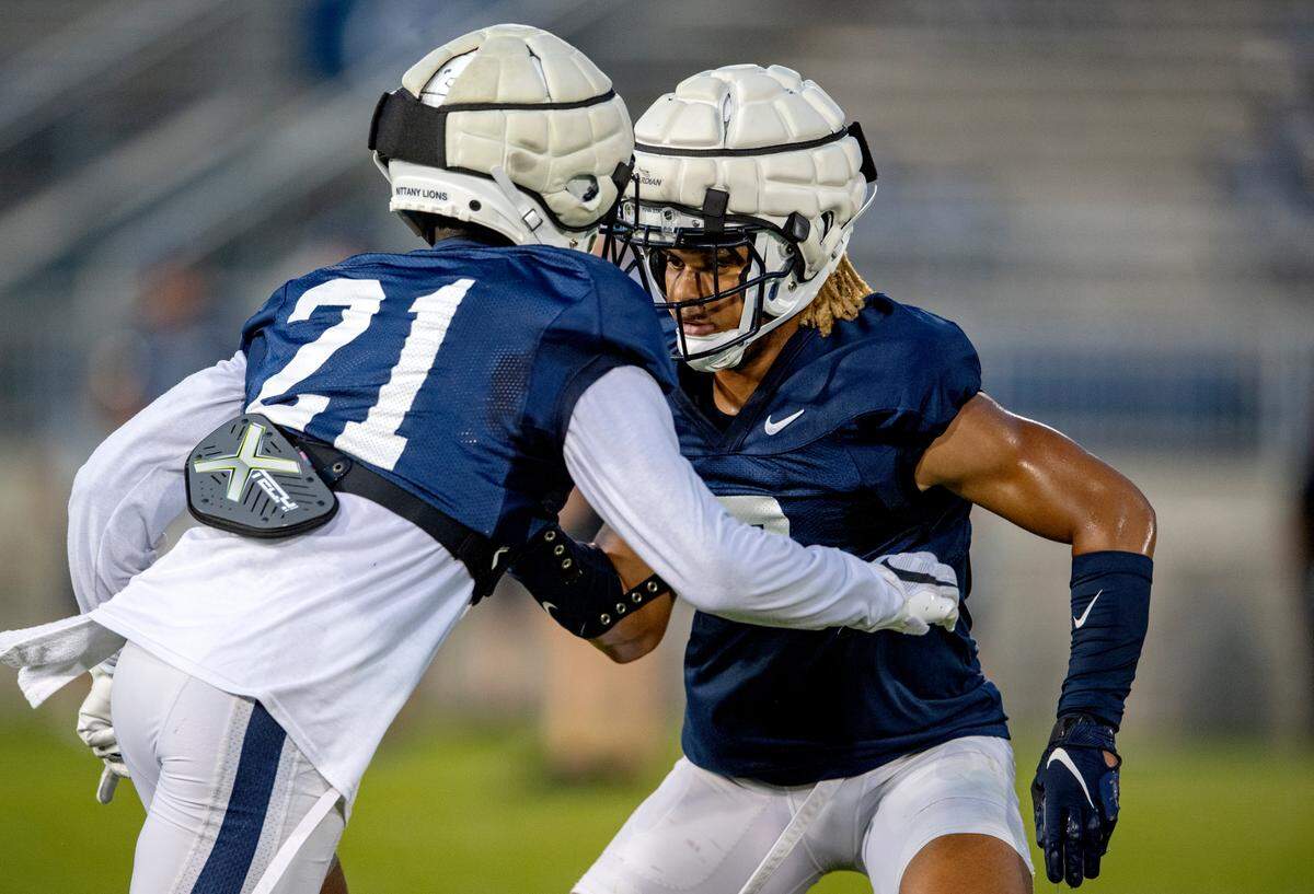 Penn State safeties Tyler Rudolph and Jaylen Reed run a drill during practice on Wednesday, Aug. 25, 2021 in Beaver Stadium.