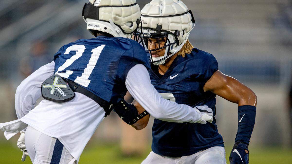 Penn State safeties Tyler Rudolph and Jaylen Reed run a drill during practice on Wednesday, Aug. 25, 2021 in Beaver Stadium.