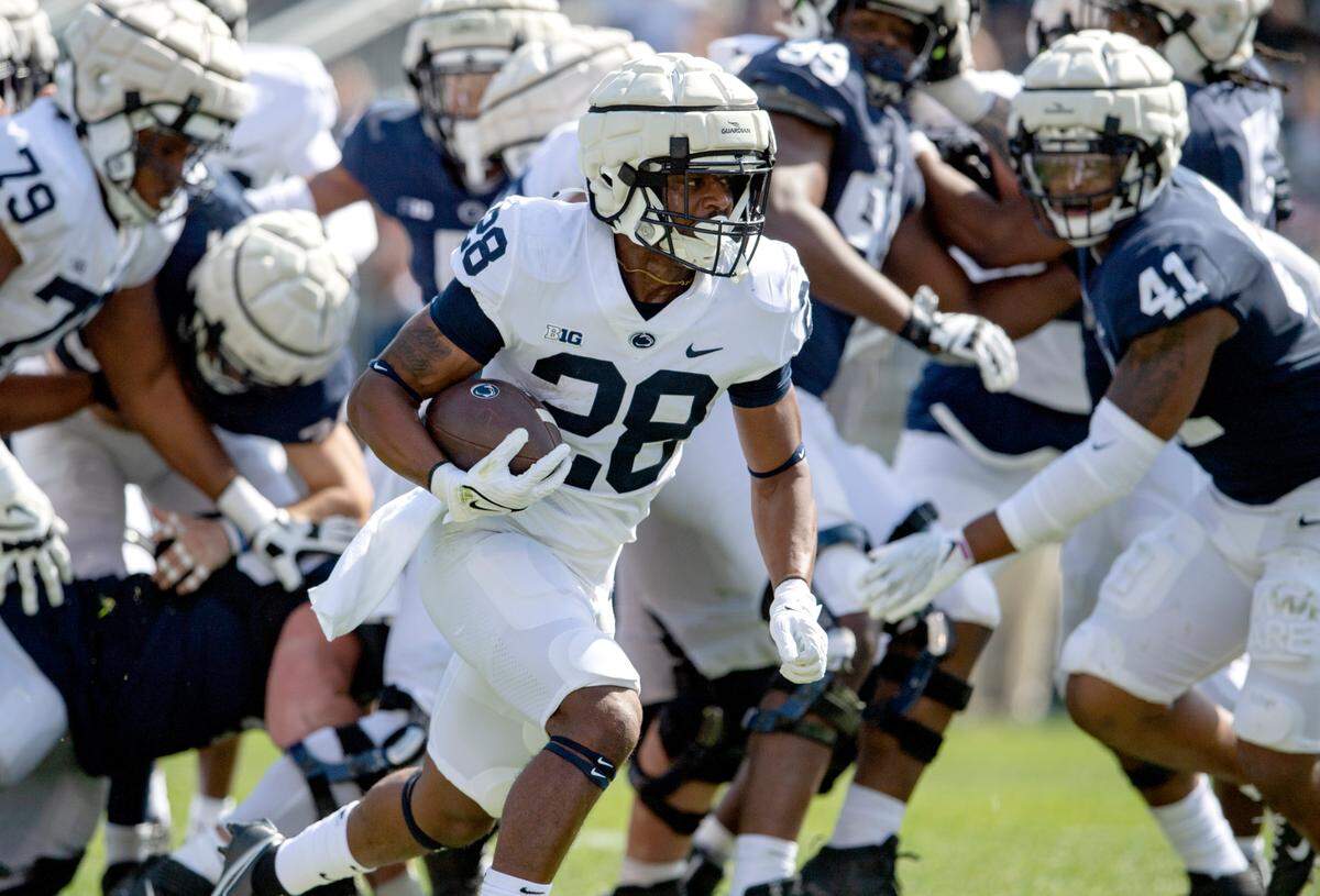 Penn State running back Devyn Ford runs with the ball during the Blue-White game on Saturday, April 23, 2022.