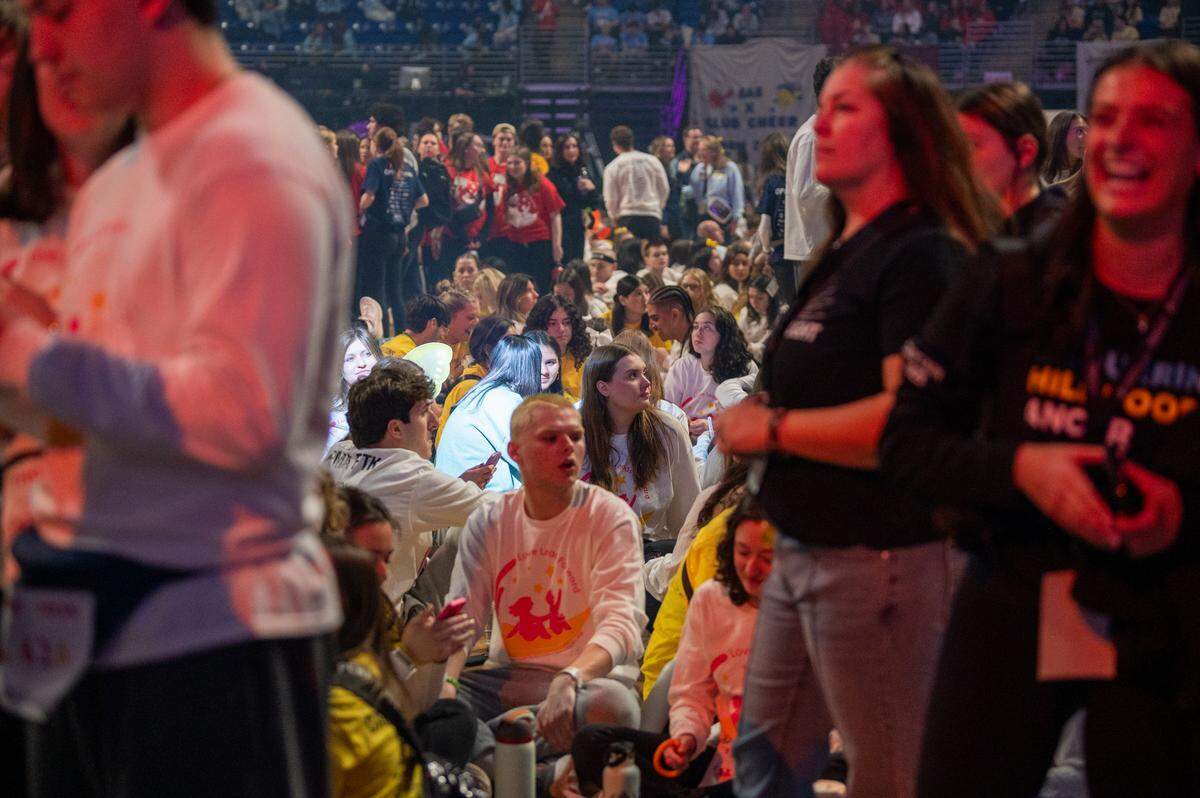 Dancers are seen sitting on the floor before standing for Thon on Friday, Feb. 20, 2026.