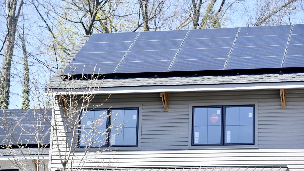Solar panels line the roof of State College Community Land Trust’s GreenBuild housing project in 2018.