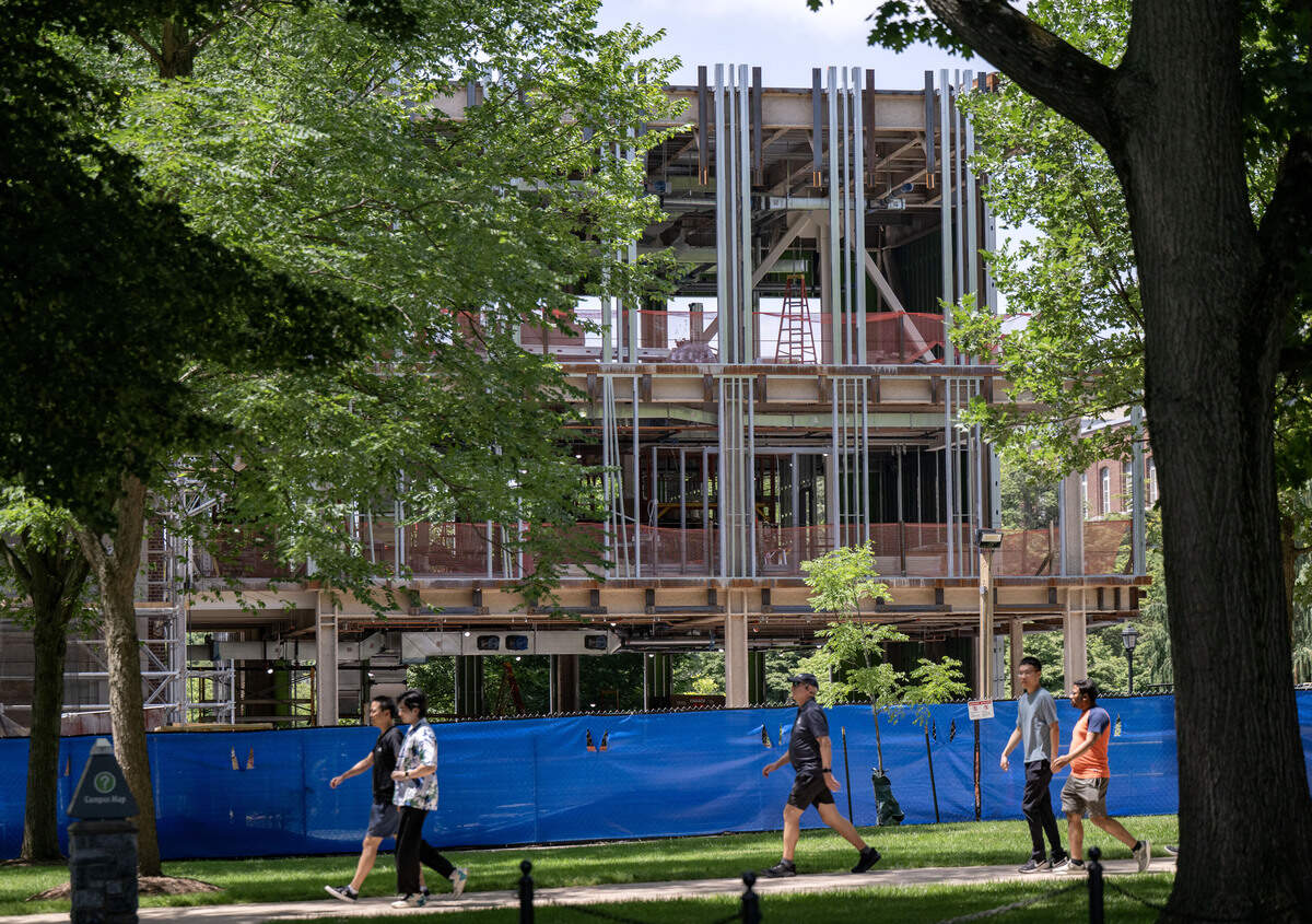 People walk by the Sackett Building as renovations continue on Thursday, July 2, 2026.