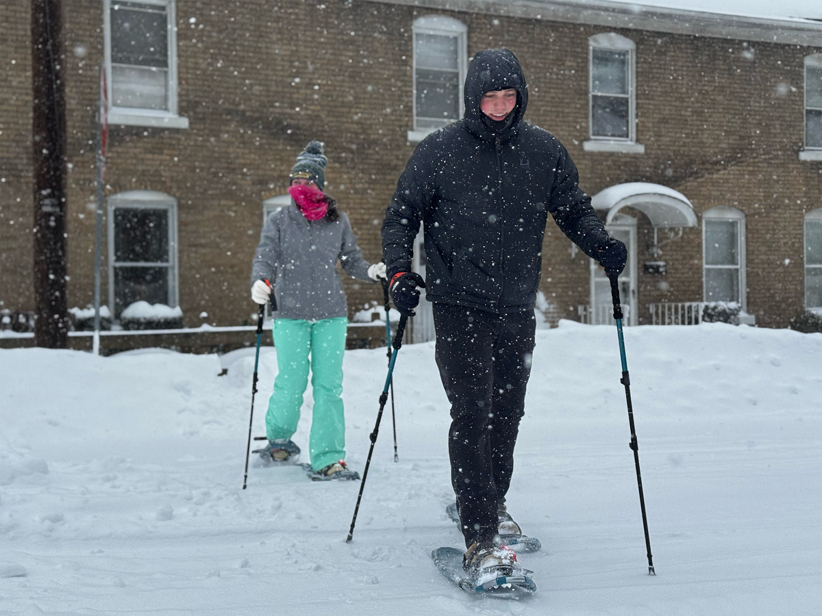 Ethan Haupt and Addison Carbaugh of Philipsburg snowshoe across South Second Street on Sunday.