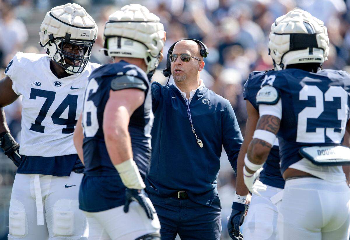 Penn State football coach James Franklin talks to the players between plays of the Blue-White game on Saturday, April 23, 2022.