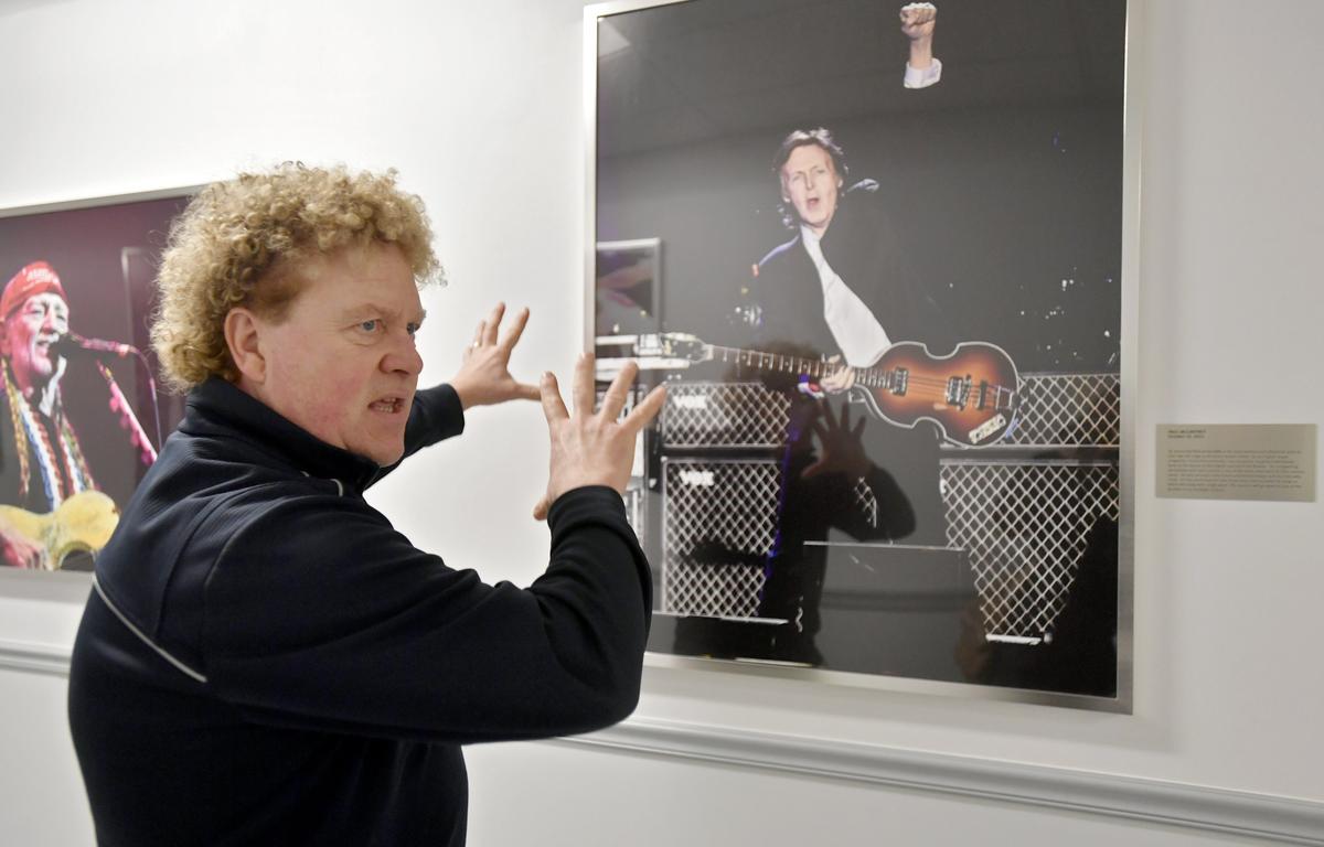 Walking down a hall at the Bryce Jordan Center filled with photos from past shows, Bernie Punt shares a story about Paul McCartney performing there in 2015. Punt is set to retire after working at the BJC for 23 years.
