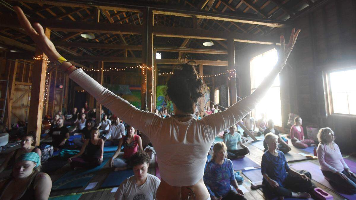 Erica Kaufman leads a community class during Yoga Fest in October 2017 at Millbrook Marsh.