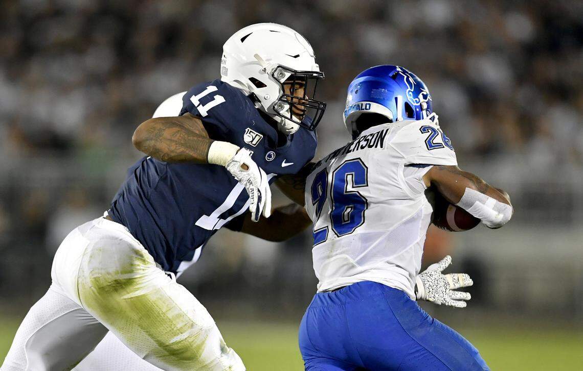 Penn State linebacker Micah Parsons reaches to stop Buffalo’s Jaret Patterson during the game on Saturday Sept. 7, 2019.