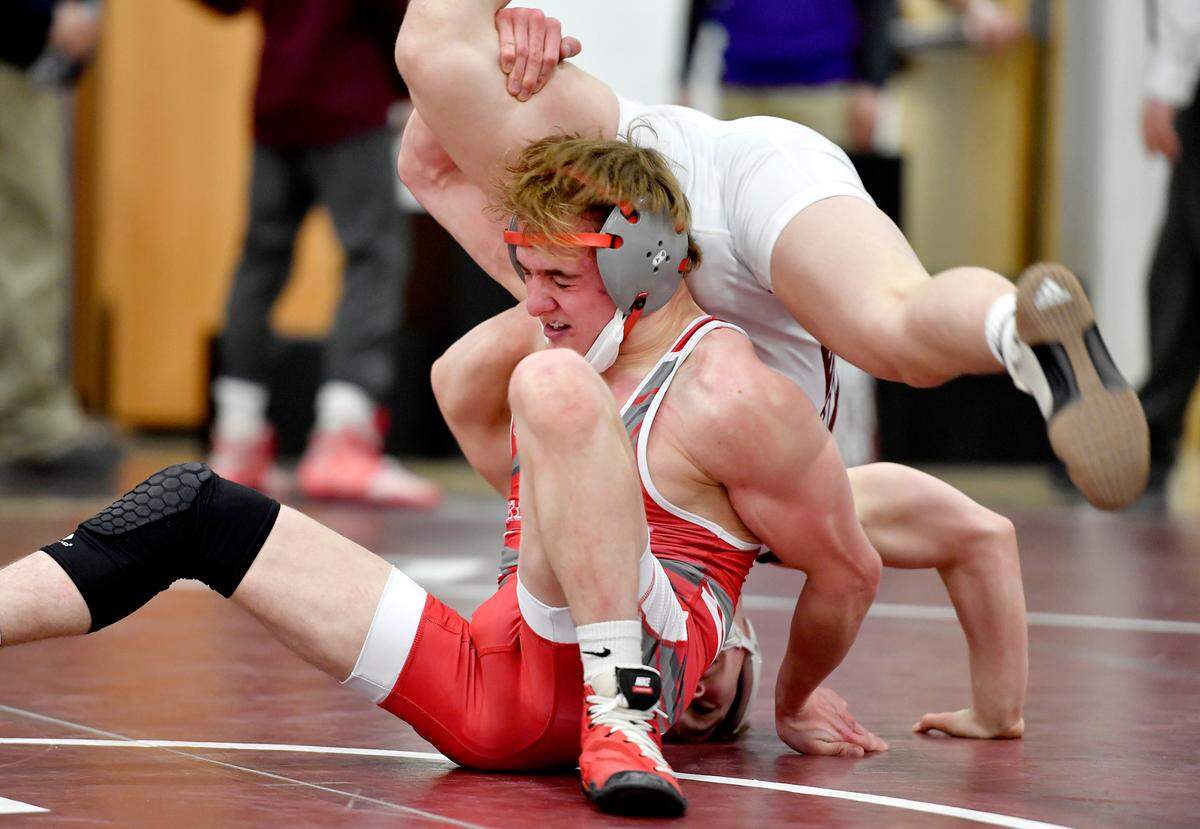 Bellefonte’s Lane Aikey wrestles Altoona’s Caleb Fasick in the 120 lb championship bout at the District 6 3A tournament on Friday, Feb. 19, 2021 at Altoona High School.